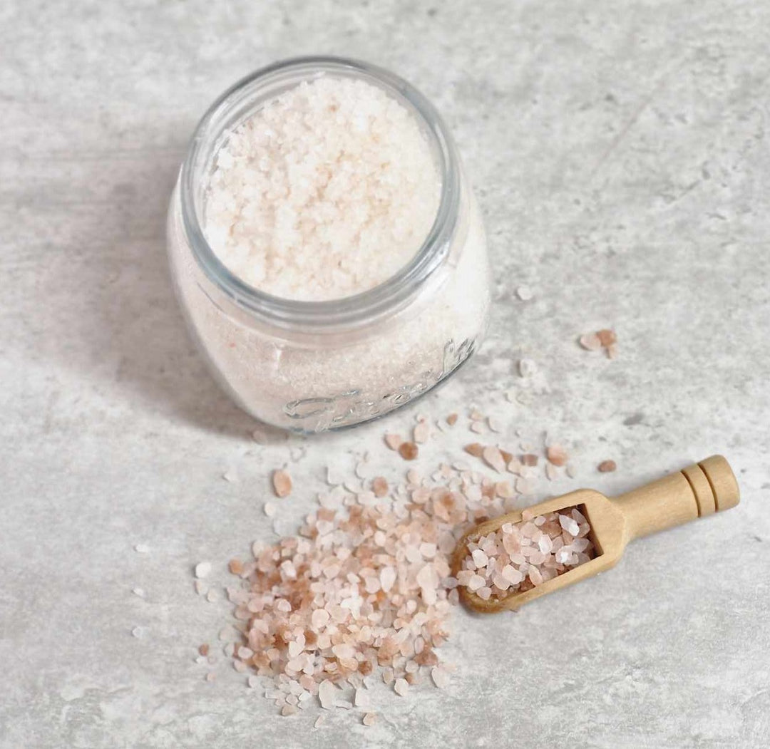 Luxury bath salts in glass jar with wooden scoop, infused with essential oils, dead sea salts, Epsom salts and Himalayan pink salt, made by handmade purple sage soap company made in Scotland