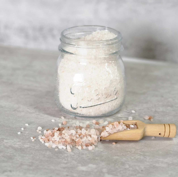 Luxury bath salts in glass jar with wooden scoop, infused with essential oils, dead sea salts, Epsom salts and Himalayan pink salt, made by handmade purple sage soap company made in Scotland